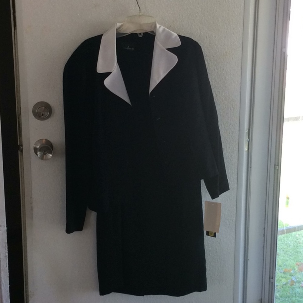 Women’s black dress with jacket.
